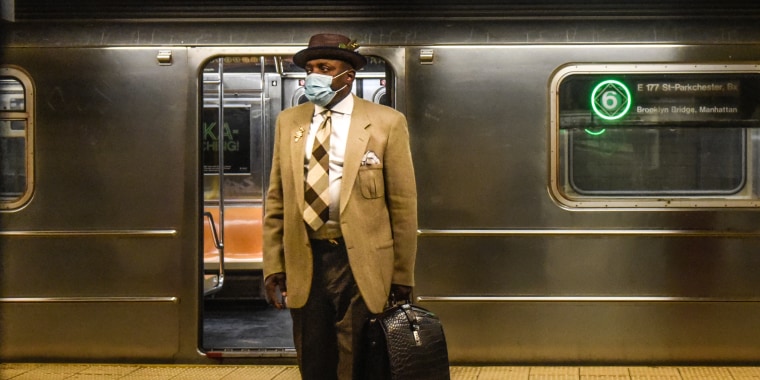 A commuter waits on the platform at a subway station in New York, on March 22, 2023. 