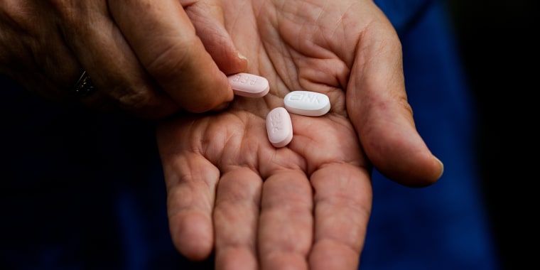 Mary Ann Neilsen holds her last Paxlovid pills while recovering from Covid-19 in Santa Barbara, Calif.