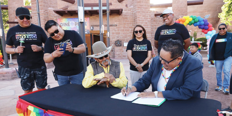 Delegate Seth Damon, right, signs Legislation 0139-23, which aims to repeal Title 9 of the Navajo Nation
Code to recognize same-sex marriages.