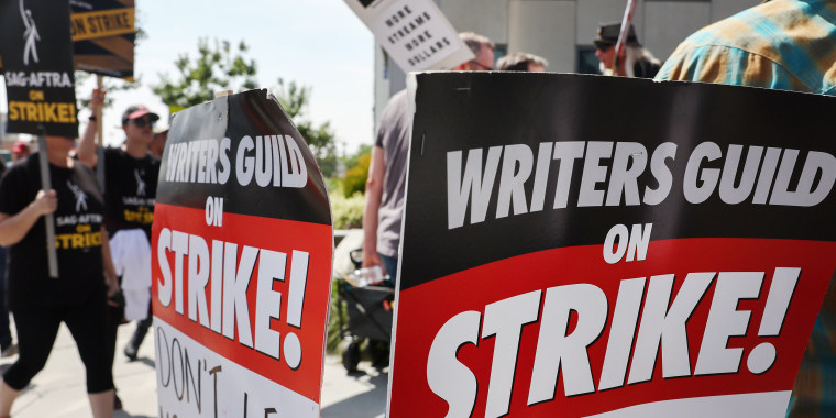 Striking Writers Guild of America and SAG-AFTRA members picket  outside Netflix studios on September 22, 2023 in Los Angeles.