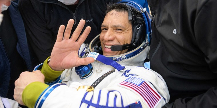 Frank Rubio is assisted out of the Soyuz MS-23 capsule
