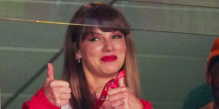 Taylor Swift reacts during a football game