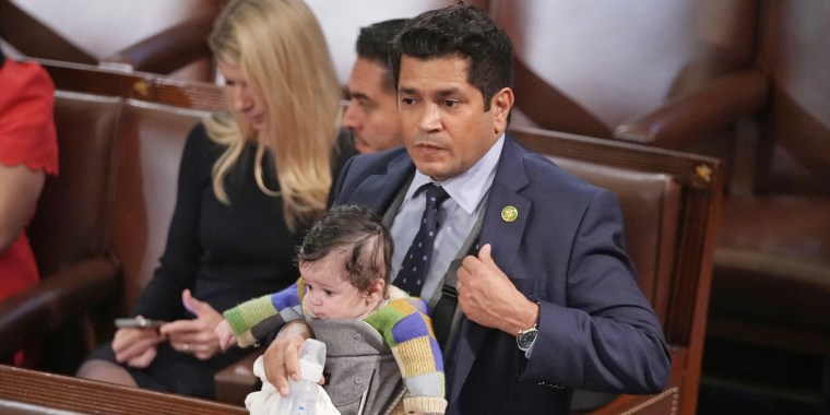 Rep. Jimmy Gomez, D-Calif., carries his infant son Hodge on the chamber floor on Jan. 5, 2023.
