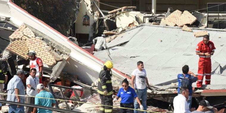 Rescue workers search for survivors amid debris after the roof of a church collapsed during a Sunday Mass in Ciudad Madero, Mexico.