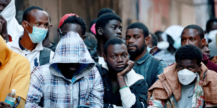 Migrants  outside the Roosevelt Hotel in New York City on Aug. 2, 2023.