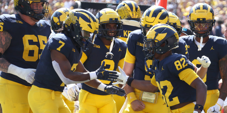 The Michigan Wolverines celebrate a touchdown against Rutgers in