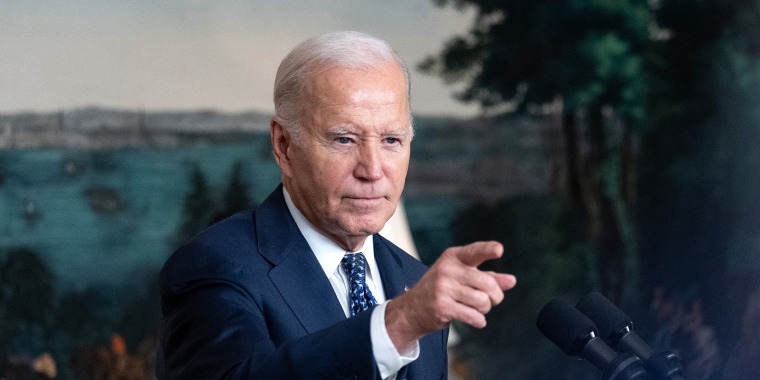 President Joe Biden responds to a question 