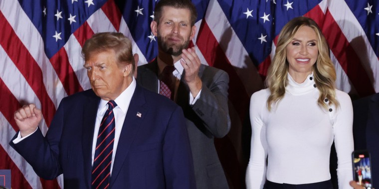 Donald Trump delivers remarks alongside Eric and Lara Trump during his primary night rally.