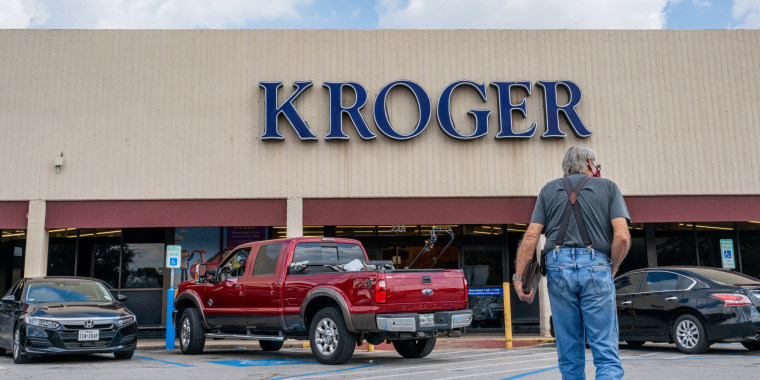 A customer walks into a Kroger grocery store in Houston