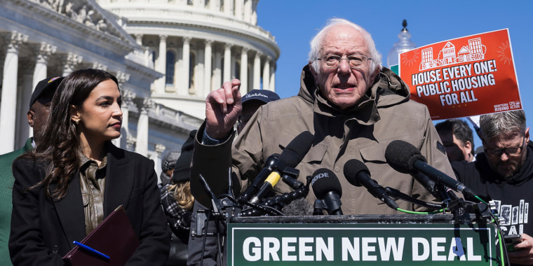 Bernie Sanders and Alexandria Ocasio-Cortez with other Democratic lawmakers and advocates reintroducing the Green New Deal for Public Housing outside the U.S. Capitol, on March 21, 2024.
