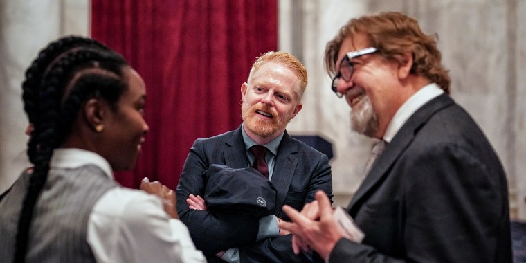 Actors Jesse Tyler Ferguson and Danai Gurira talk to Oskar Eustis in the Russell Senate Office Building while advocating for the Save Our Stages Act on April 11, 2024.