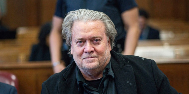 Bleary-eyed and unshaven Steve Bannon looking into the camera