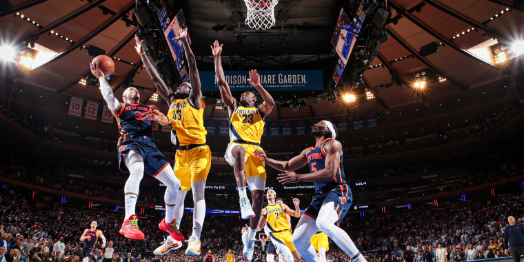 New York Knicks player drives to the basket.