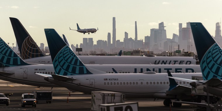 A plane lands at Newark Liberty International Airport 