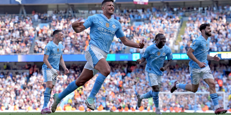 Manchester City's Rodri celebrates scoring their side's third goal