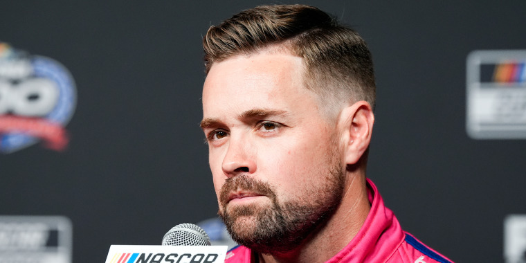 Ricky Stenhouse Jr. in front of a microphone during a conference