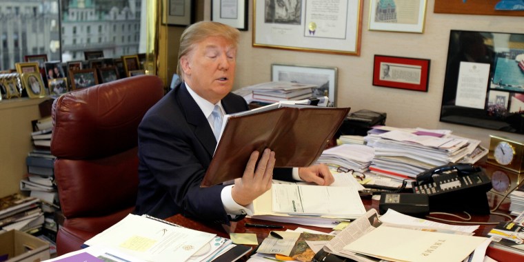 Donald Trump works at his desk in his New York office, Monday, Nov. 22, 2010
