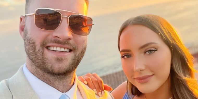 A photo of Mathers and her new husband in front of a sunset.