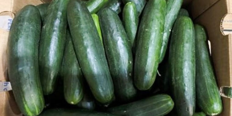 A box filled with cucumbers