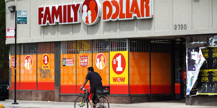 A cyclist rides past a Family Dollar store in Chicago