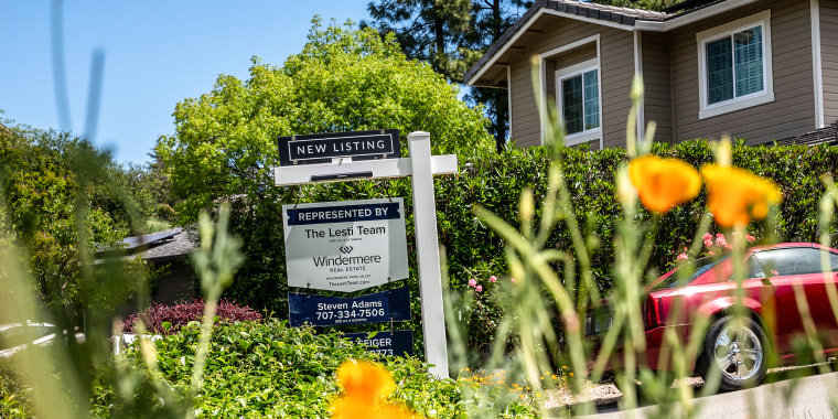 A "New Listing" sign outside a home 