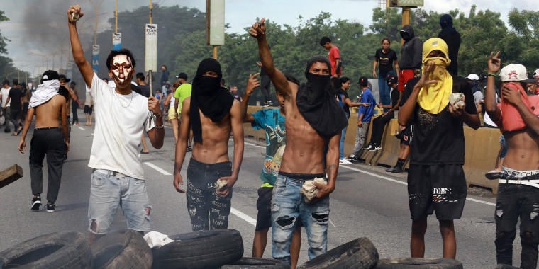 Demonstrators set up a barricade during a protest against Venezuelan President Nicolas Maduro's government in Valencia, Venezuela