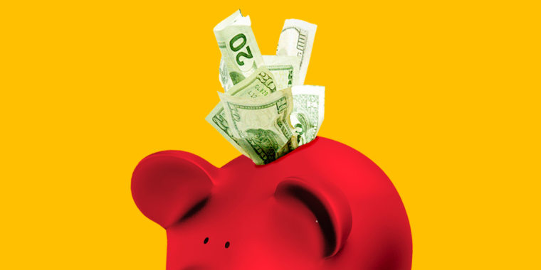 Photo Illustration: A red elephant piggy bank with money sticking out the top