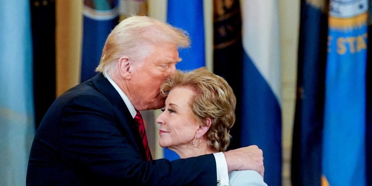 President Donald Trump speaks with Linda McMahon