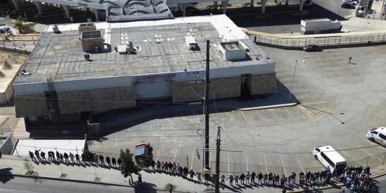 Migrants, mostly from Venezuela, hold a prayer vigil outside the Mexican immigration detention center that had a deadly fire one month prior in Ciudad Juarez, Mexico, on April, 27, 2023. 