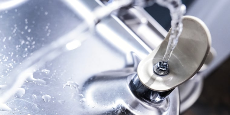 Water spurting out of a water fountain head