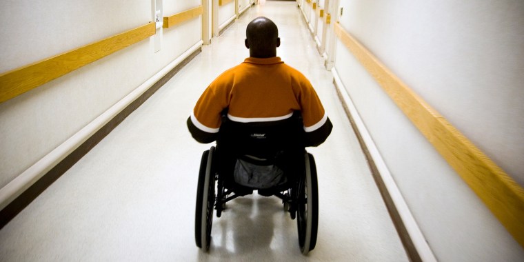 A veteran in a wheelchair in the hallway of the Veterans Affairs Medical Center in Washington