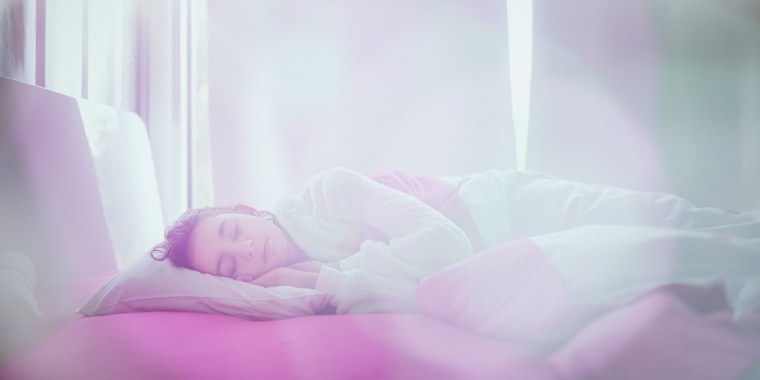 Girl sleeping near sunny window