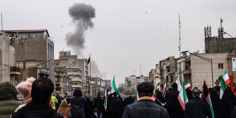 Image: Black smoke rises following an airstrike in Tehran