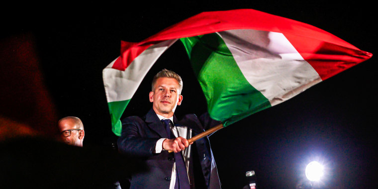 New Prime Minister of Hungary Peter Magyar waves a Hungarian