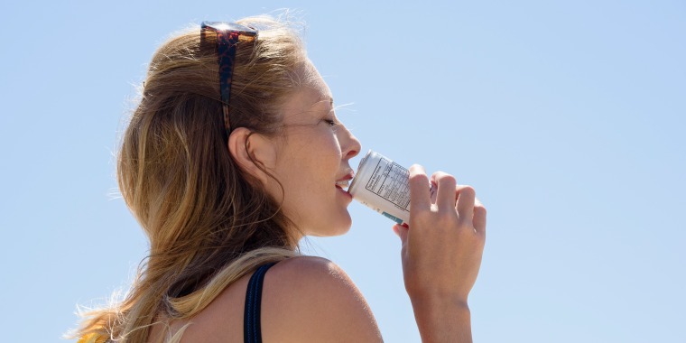 Beautiful woman enjoying cold drink