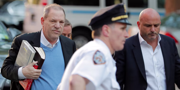 Image: Film producer Harvey Weinstein arrives at the 1st Precinct in Manhattan in New York