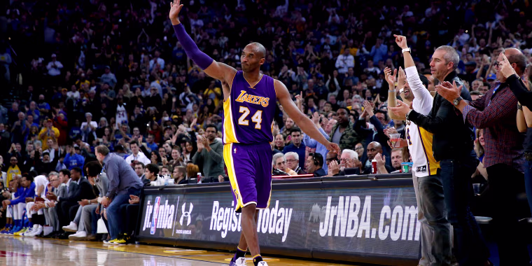 Image: Kobe Bryant of the Los Angeles Lakers waves to the crowd after being taken out of the game in the fourth quarter against the Golden State Warriors at ORACLE Arena on January 14, 2016 in Oakland.