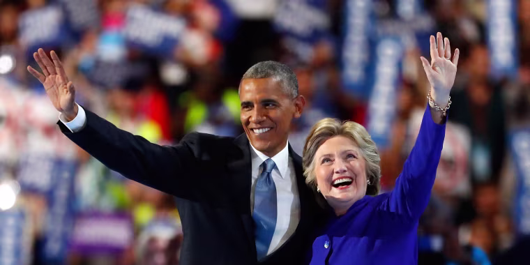 Barack Obama and Hillary Clinton wave to the crowd