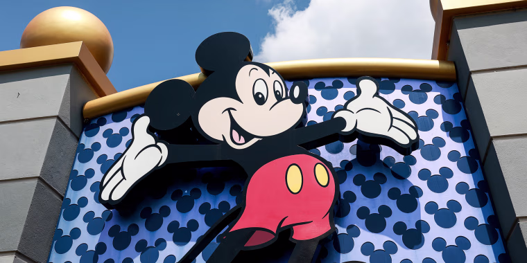 A Mickey Mouse sign showing Mickey smiling with his arms outstretched