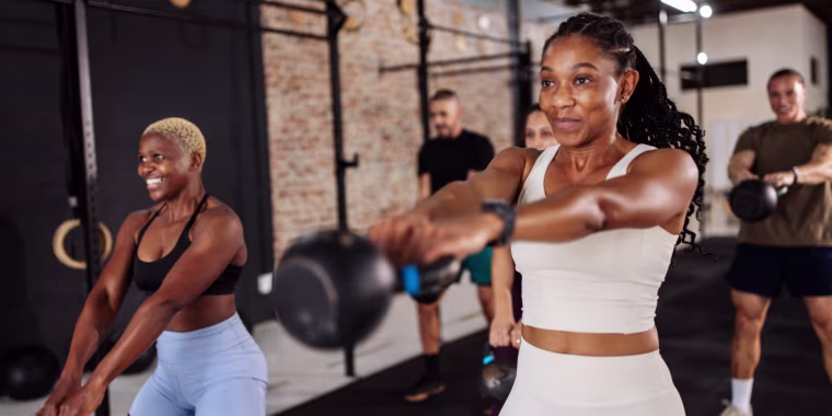 friends doing kettlebell workout