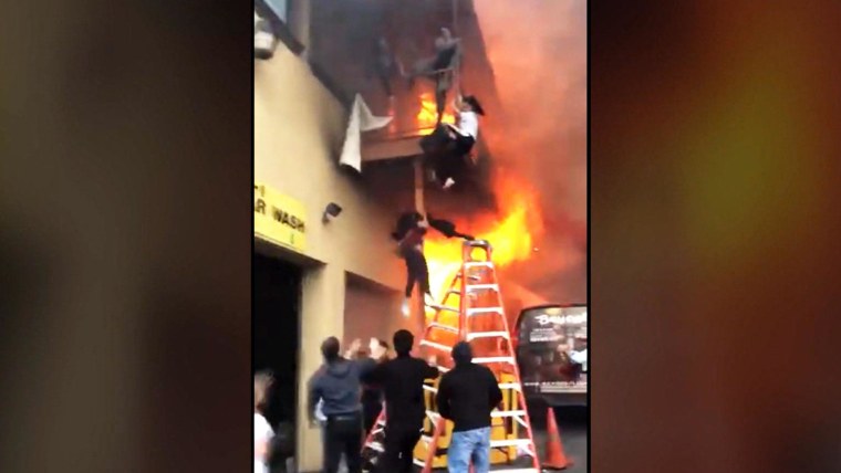 Girls leap from balcony to escape dance studio fire