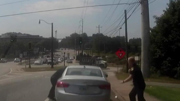 Video shows officer being dragged by a suspect’s car