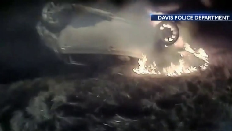Police officer saves woman from fiery crash in dramatic rescue