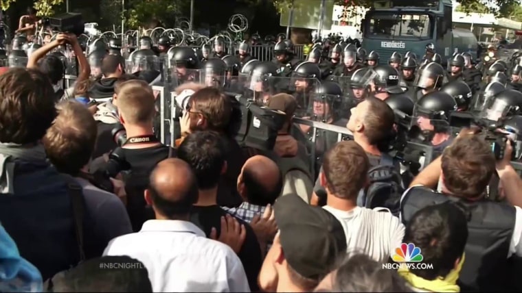 Hungarian Police Fire Tear Gas to Hold Back Migrants at Border