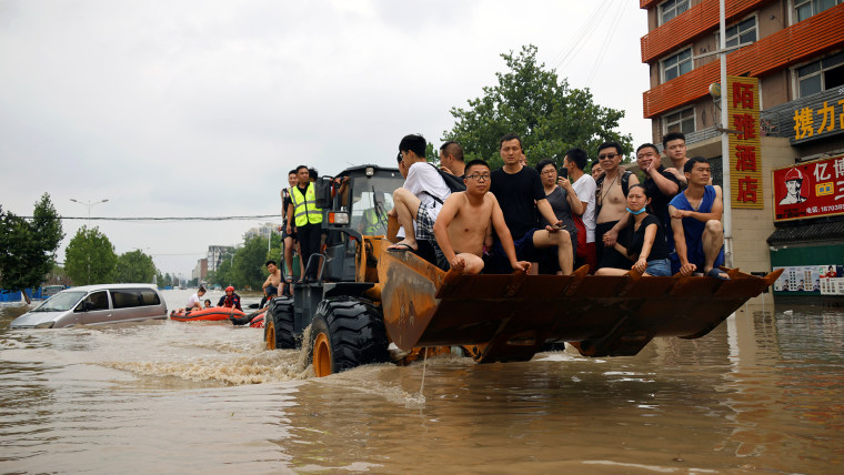 China cities declare 'red alerts' as flood death toll hits 21
