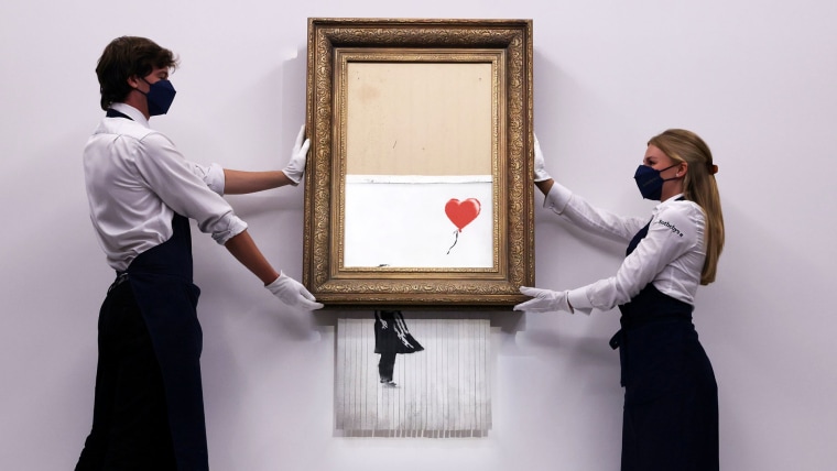 Banksy's self-destructing painting sells for over $25 million, setting  auction record