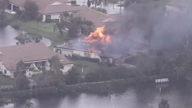 Aerial video shows flames engulfing flooded home damaged by Hurricane Ian  in Lee County