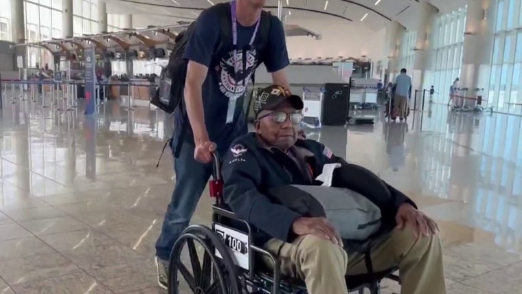 World War Two Veteran In Wheelchair Outdoors Wearing Cap Stock