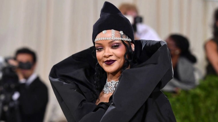 Rihanna shows off baby bump in black lingerie to celebrate the 5th