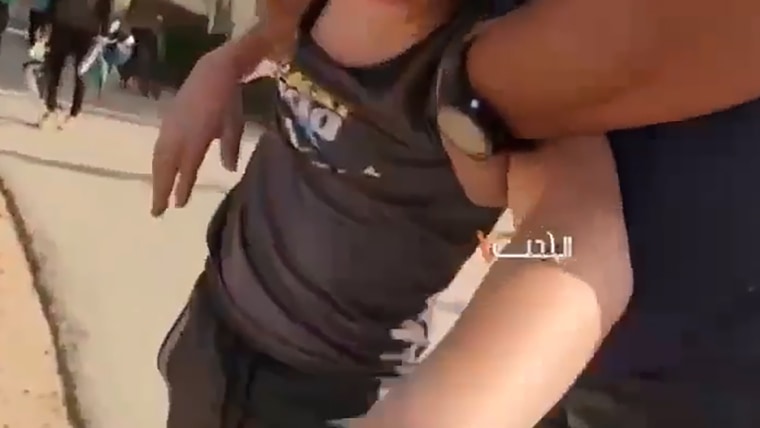 Video shows Hamas militants kidnapping 12-year-old boy